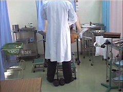 Asian stretches legs in the gyno office