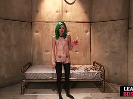 BDSM babe vibrates pussy while bound during masterclass
