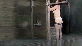 BDSM sub spanked while in stocks
