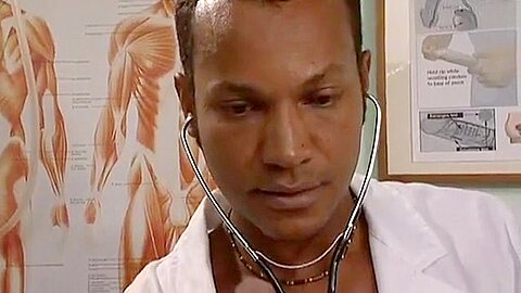 Black doctor examines white gay