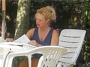Blonde MILF stripping outside