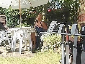 Blonde MILF stripping outside