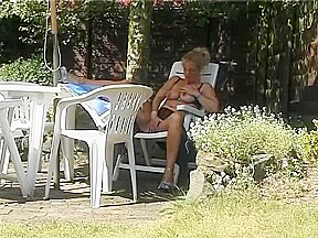 Blonde MILF stripping outside