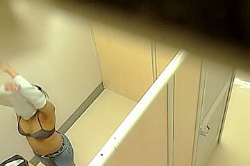 Blonde and brunette naked boobs in the changing room