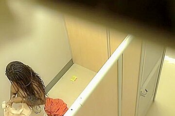 Blonde and brunette naked boobs in the changing room