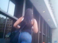Candid brunette wearing glasses with BIG ass in jeans