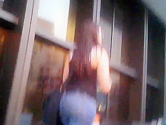 Candid brunette wearing glasses with BIG ass in jeans