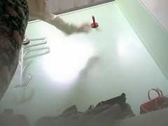 Changing room footage of girl trying on bras