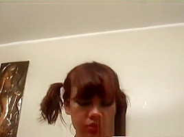 Cute redhead teen 18+ with pigtails Leona exposes her body for the camera