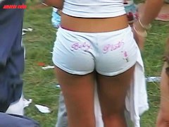 Dark skinned beauty stands in short shorts and a thong ass vid