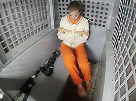 Female Prisoner Strapped in for Transport (She will not return)