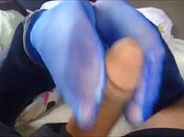 Footjob in blue nylon socks