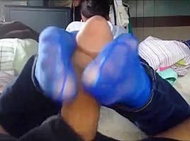 Footjob in blue nylon socks