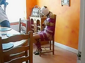 Girl wrapped with tape on the chair
