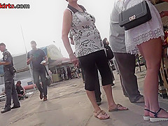 G-string of a sexy lassie seen in free upskirt video