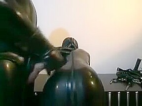 Horny Slut Gets In Latex Suit To Suck