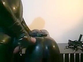 Horny Slut Gets In Latex Suit To Suck