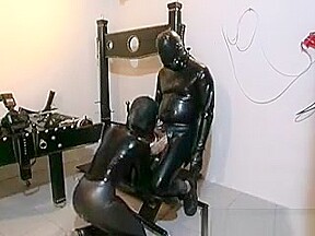 Horny Slut Gets In Latex Suit To Suck