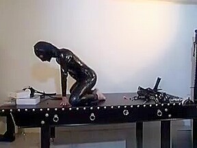 Horny Slut Gets In Latex Suit To Suck