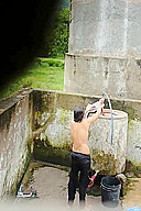 Indian Village Girl Bathing Near Water Tank Outdoor