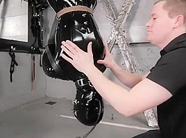 Latex slave upside down