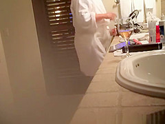 Mature wife spied in bathroom smoking and drinking