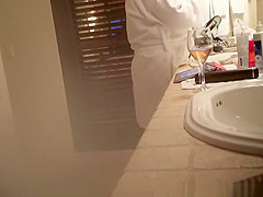 Mature wife spied in bathroom smoking and drinking
