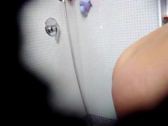 My girlfriend taking a shower and fingering her pussy