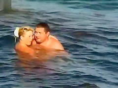NUDIST COUPLES ON BEACH
