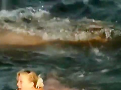 NUDIST COUPLES ON BEACH