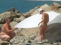 NUDIST COUPLES ON BEACH