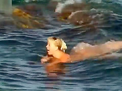 NUDIST COUPLES ON BEACH