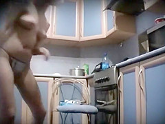 Naked woman peeped applying make up
