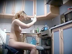 Naked woman peeped applying make up