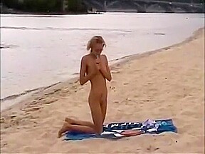 Nude girls outdoor on public beach having fun