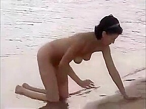 Nude girls outdoor on public beach having fun