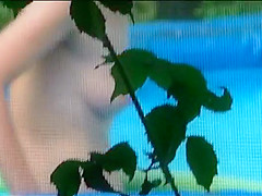 Peeping a topless neighbor cleaning pool