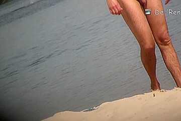 Playful chicks demonstrate their tits in the nude beach