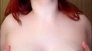 Red Head Jessica Sage Plays With Her Huge Tits