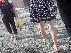 Red head gal shows off g-string in candid upskirts
