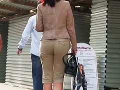 Round and tight woman ass in brown pants video
