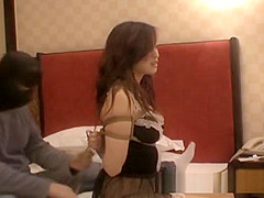 Sexy Chinese girl in sexy dress bounded in hotel