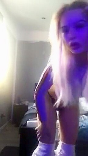 Sexy blonde strips and plays infront of the camera