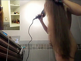 Sexy brunette brushing and blowdry long hair long hair