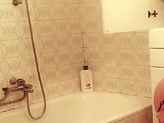 Sexy girl showers and wipes off