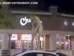 Skinny exhibitionist undresses in a fast food parking lot
