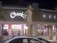 Skinny exhibitionist undresses in a fast food parking lot