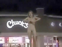 Skinny exhibitionist undresses in a fast food parking lot