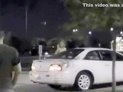 Skinny exhibitionist undresses in a fast food parking lot
