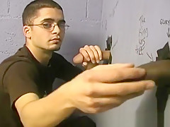 Thin gay white guy sucking off black cocks at a gloryhole